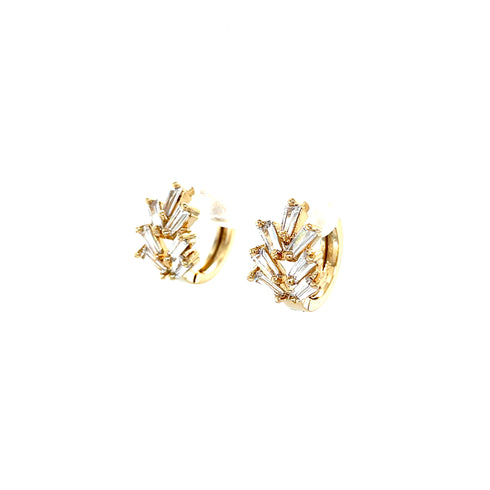 The Zirconia Stones Huggies earrings in 10k gold filled material showcase a beautiful, intricate branch-like design adorned with shimmering zirconia stones. Set against a plain white background, they exude elegance and charm.